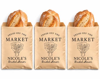 May include: Three light brown paper bags, each containing a loaf of crusty bread. The bags feature black text that reads FRESH OFF THE MARKET and NICOLE'S Bridal Shower, along with a black line drawing of a flower bouquet in the center.