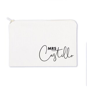 May include: White canvas zippered pouch with black text that reads "MRS Castillo" in a cursive font.