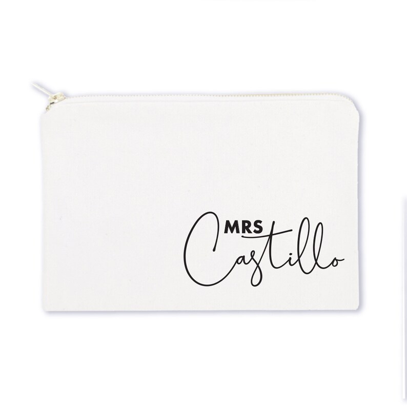 May include: White canvas zippered pouch with black text that reads "MRS Castillo" in a cursive font.