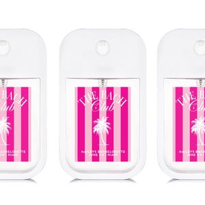 Three identical white spray bottles with pink and white labels that say "The Beach Club" and "Haisley's Bachelorette June 5-8 Miami".