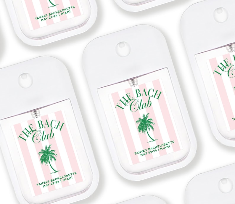 multiple identical white spray bottles with pink and green labels, each featuring the text "The BAC CLUB" and "TANYA BACULOYETTE MAY 22-24 JAMAICA" printed on them.