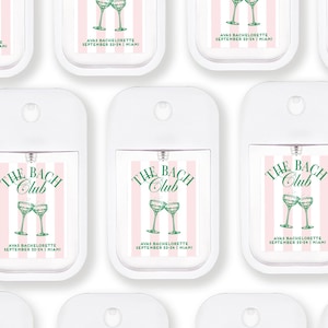 multiple identical white spray pump bottles with pink and green labels, each featuring the text "The BACH Club" and "AVAS BACHLORELETTE SEPTEMBER 23-24(1) MEXICO" printed on them.