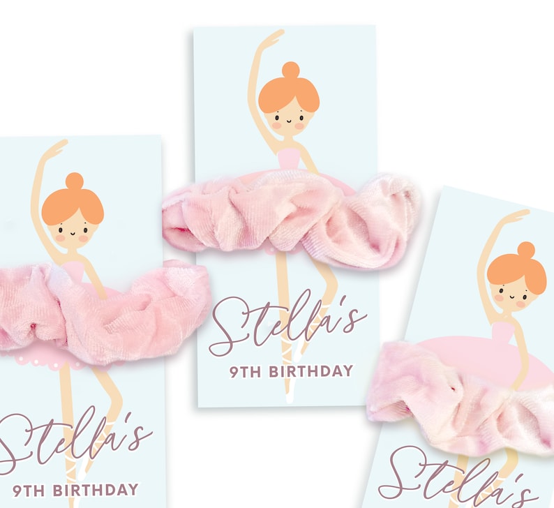 May include: Three pink and white ballerina-themed party favour tags with the text "Stella's 9th Birthday" and a pink scrunchie attached to each tag.