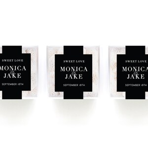 May include: Three clear boxes filled with white candy, each with a black label that reads "Sweet Love Monica & Jake September 18th".