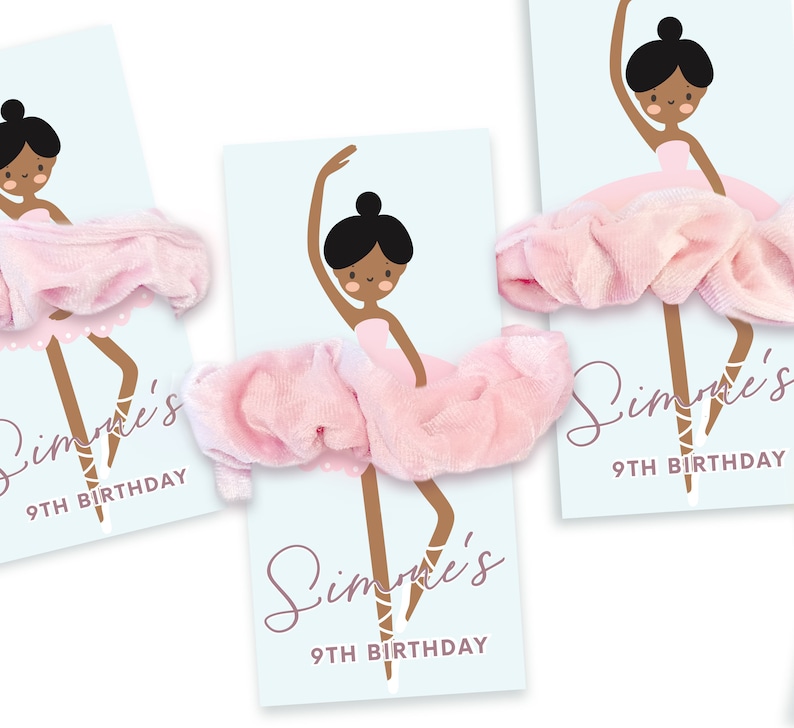 May include: Three pink scrunchies with a ballerina illustration and the text "Simone's 9th Birthday" on a blue background.