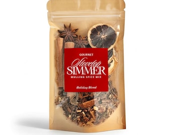 May include: A clear, resealable bag filled with a mulling spice mix. The bag features a red label with the words "Gourmet Stovetop Simmer Mulling Spice Mix Holiday Blend." Visible spices include star anise, cinnamon sticks, and dried citrus.