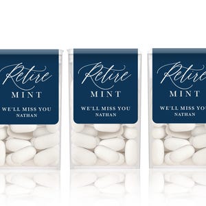 May include: Five clear rectangular plastic containers filled with white mints. Each container features a dark blue label with white text that reads Retire MINT, WE'LL MISS YOU, and NATHAN in a combination of script and sans-serif fonts.