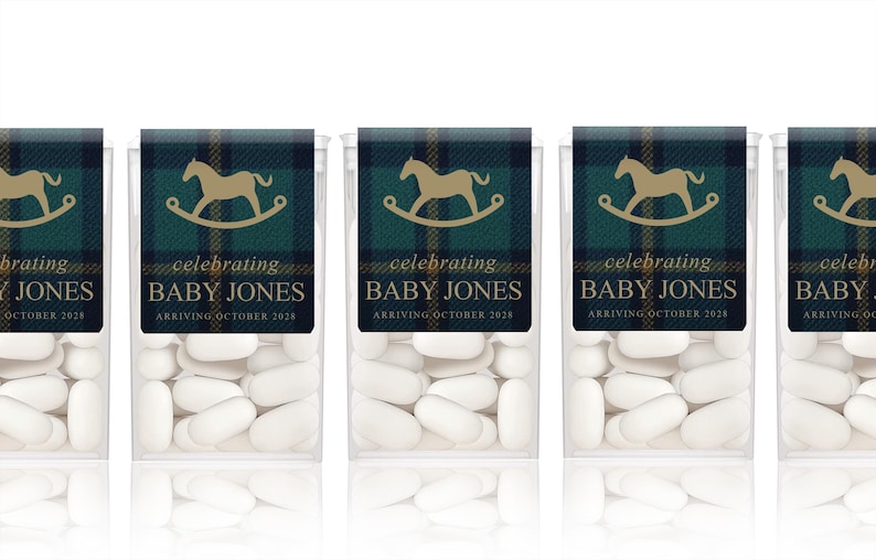 May include: Five clear plastic containers of mints with labels that say "celebrating Baby Jones arriving October 2028". Each label has a green and blue plaid pattern with a gold rocking horse.