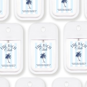 multiple identical white spray bottles with labels that say "The Bach Club Dominican Republic" and "Quin's Bachelorette Dominican Republic".