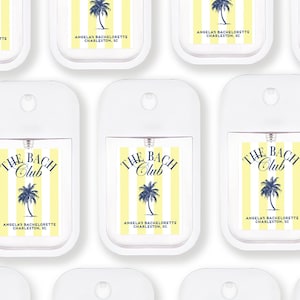 multiple identical white spray bottles with yellow and blue stripes, each featuring the text "The BACH Club" and "Angela's Bachelorette Charleston, SC".
