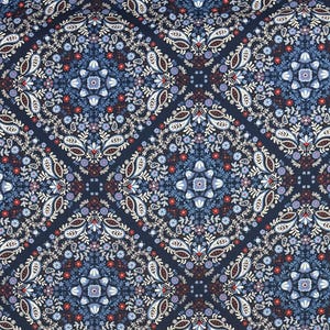 May include: A detailed fabric pattern featuring a repeating design of floral and paisley elements in a diamond grid. The color palette includes navy blue, white, red, and lavender, creating a rich and intricate visual texture.