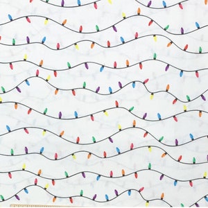 May include: White fabric with a repeating pattern of black lines and colorful Christmas lights. The lights are in various colors, including red, yellow, green, blue, and purple. The lights are strung along wavy black lines.