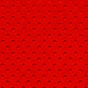 May include: A close-up of a vibrant red fabric with a textured pattern. The pattern consists of evenly spaced, raised, circular bumps across the entire surface. The fabric appears soft and plush, with a consistent color and texture throughout.