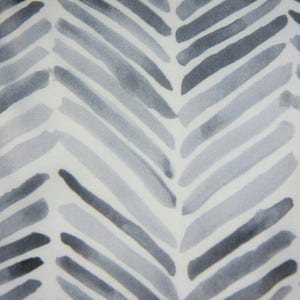 May include: A white background with a gray and white chevron pattern. The pattern is made up of thin, horizontal lines that are slightly faded in the center.