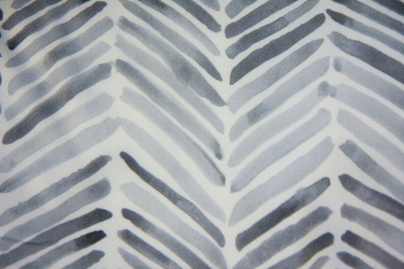 May include: A white background with a gray and white chevron pattern. The pattern is made up of thin, horizontal lines that are slightly faded in the center.
