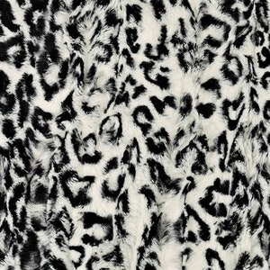 May include: Black and white faux fur fabric with a leopard print pattern.