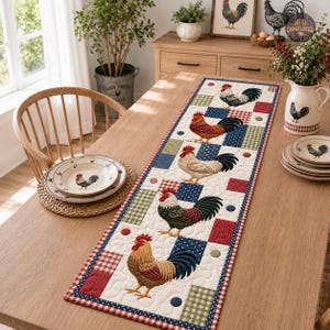 May include: A rectangular quilted table runner featuring a repeating pattern of five roosters in various colours, interspersed with squares of red and white gingham, blue and white polka dots, and green and white plaid fabric on a cream background.