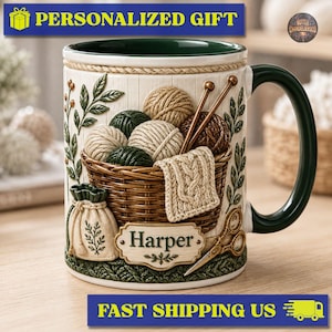 May include: A ceramic mug with a dark green handle and interior, featuring a raised relief design of a woven basket filled with yarn balls, knitting needles, and a small pouch. A rectangular plaque on the front displays the name Harper in green text.