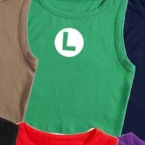 May include: A green tank top with a white circle and a large white "L" on the front. Other tank tops in various colors, including brown, red, and navy blue, are partially visible.