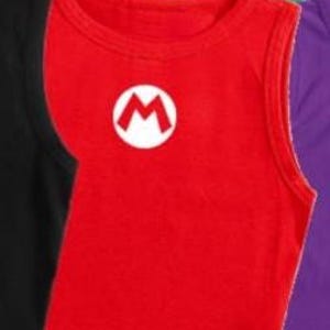 May include: A red crop top with a white circle and a red "M" logo. The sleeveless shirt is made of a soft material and is part of a collection of colorful tops.
