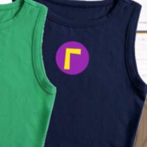 May include: A navy blue sleeveless shirt with a purple circle and a yellow "L" graphic. A green sleeveless shirt is visible to the left. The shirts are made of a soft material.
