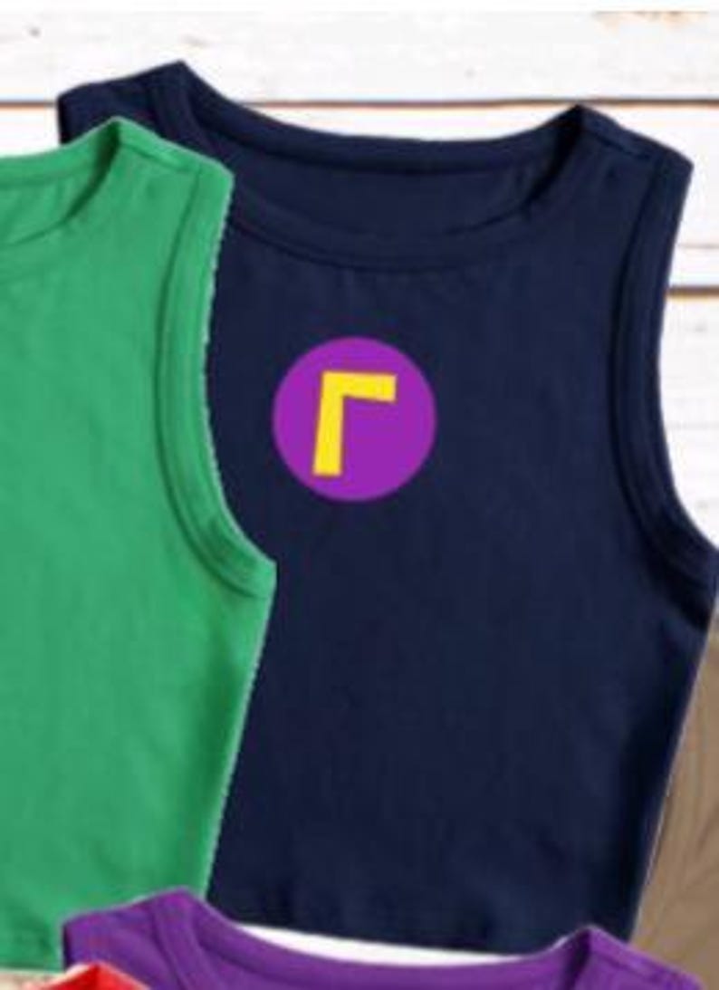 May include: A navy blue sleeveless shirt with a purple circle and a yellow "L" graphic. A green sleeveless shirt is visible to the left. The shirts are made of a soft material.