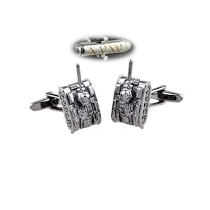 May include: A pair of silver cufflinks featuring a detailed tank design. The cufflinks are a great way to add a touch of personality to any outfit.