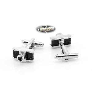 May include: A pair of silver cufflinks with a black camera design. Each cufflink has a black stone in the center of the camera lens.