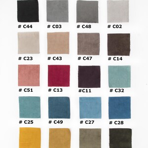 May include: A selection of corduroy fabric samples in a range of colours, including black, grey, beige, brown, pink, red, teal, blue, and yellow. Each swatch is labelled with a unique code, such as #C44, #C03, and #C48.