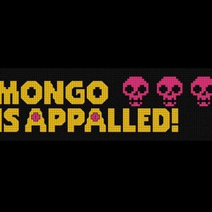 May include: Cross-stitch design on black fabric. The text "MONGO IS APPALLED!" is in yellow, with pink accents. Three pink pixelated skulls are to the right of the text. The design has a retro video game aesthetic.