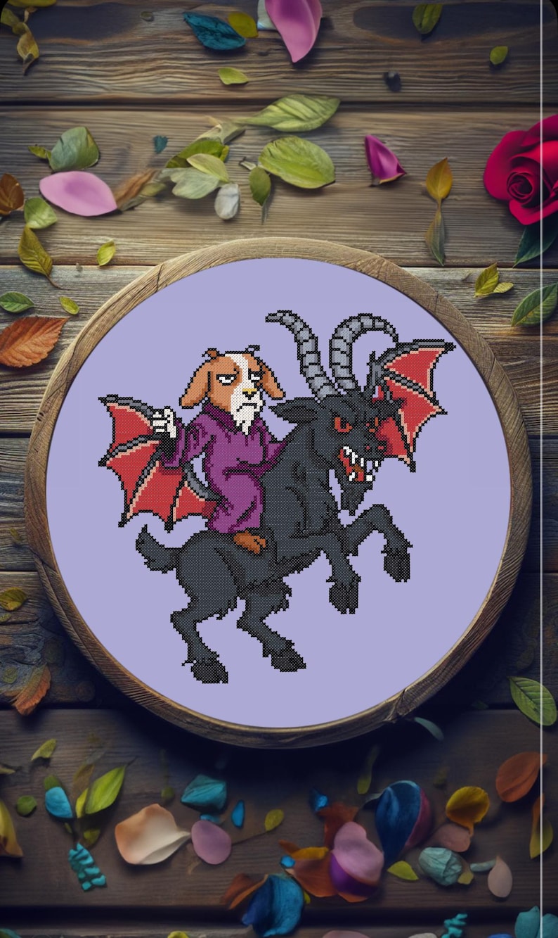 May include: A cross-stitch embroidery featuring a dog-like creature riding a black goat with red bat wings. The dog wears a purple robe. The artwork is set in a wooden embroidery hoop with a lavender background, surrounded by leaves and a rose.