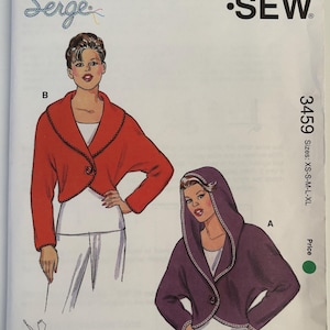 May include: Kwik Sew pattern 3459 for misses' sizes XS-XL. The pattern features illustrations of two different jacket styles, one red and one purple, with a button closure. The pattern includes the text "Kwik Sew" and "Serge".