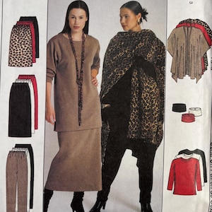 May include: McCall's sewing pattern featuring various clothing options. The pattern includes designs for skirts, pants, and tops. The cover showcases a woman wearing a brown skirt suit and another wearing a leopard print shawl. The pattern number is 9595.
