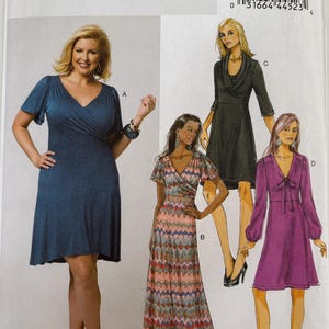 May include: Butterick sewing pattern B5794 for dresses in sizes 8-16. The envelope displays four dress variations: a solid blue wrap dress with flutter sleeves, a long patterned maxi dress, a black cowl-neck dress, and a purple dress with long sleeves.