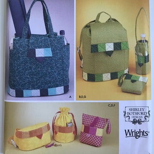 May include: A Simplicity 5320 sewing pattern envelope for accessories. The front displays a blue floral tote bag, a green checkered backpack, a matching bottle holder, a yellow waist bag, a yellow drawstring pouch, and a small checkered pouch.