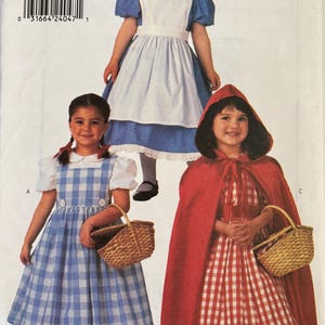 May include: Butterick sewing pattern 4600 featuring three costume designs. One blue dress with a white apron, one blue and white gingham dress with a white blouse, and one red and white gingham dress with a matching red hooded cape and basket.