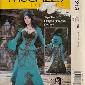 May include: McCall's M7218 sewing pattern envelope for Yaya Han's Original Peacock Costume. The teal dress features a high collar, flared sleeves, and peacock feather embellishments. Includes front and back views, size A5 (6-8-10-12-14).
