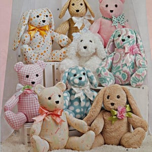 May include: A Simplicity 8044 sewing pattern envelope featuring illustrations of eight stuffed animals, including various teddy bears and rabbits in different fabrics like polka dots, gingham, and floral prints, each adorned with ribbons.
