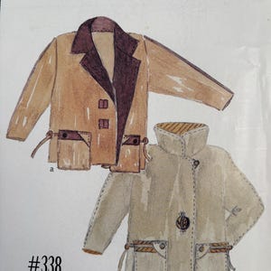 May include: A sewing pattern envelope titled pick a pocket #338 featuring watercolor illustrations of two jackets. Jacket a is tan with a dark brown collar and pockets. Jacket b is light beige with a high collar, a single button, and pockets.