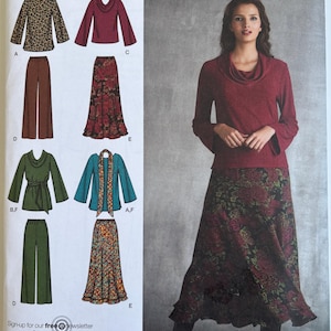 May include: Simplicity sewing pattern 3568 featuring various women's clothing designs. The pattern includes tops, skirts, and pants in different styles. The model is wearing a burgundy top and floral skirt. The pattern size is AA 10, 12, 14, 16, 18.