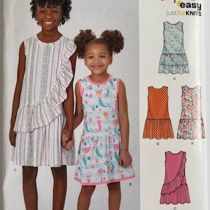 May include: A white ceramic mug with a black handle and the text "But First, Coffee" in a bold, black font. The mug is set against a neutral background, highlighting its simple design.