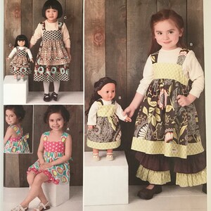 May include: Simplicity sewing pattern 1793A for children and doll clothing. The envelope features illustrations of pinafore dresses and matching doll outfits in various floral and geometric patterns, with sizes U.S. 3, 4, 5, 6, 7, and 8.