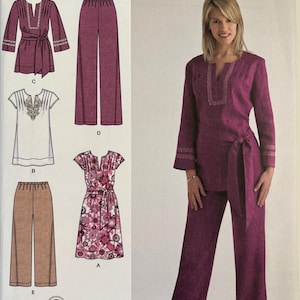 May include: Simplicity sewing pattern 2371, featuring a woman in a magenta outfit. The pattern includes options for a tunic, pants, and a floral print dress. The text "easy-to-sew" is visible.
