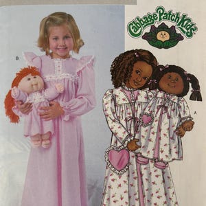 May include: A vintage Butterick sewing pattern, number 4012, featuring Cabbage Patch Kids. The pattern shows a girl in a pink nightgown holding a Cabbage Patch Kid doll, and two girls in floral pajamas with heart-shaped purses.