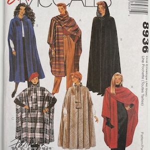 May include: McCall's sewing pattern envelope featuring various cape designs. The capes are shown in different colors and patterns, including blue, plaid, and solid black. The text "Easy" and "Fashion Basics" are visible.