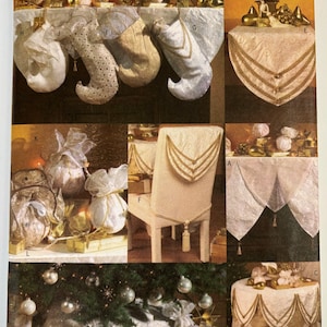 May include: A sewing pattern for a Christmas tree skirt, chair back cover, table runner, and stockings. The pattern is from Vogue Crafts and is for one size. The pattern includes instructions for making the items in white fabric with gold trim.