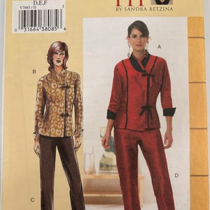 May include: A sewing pattern envelope labeled V7885 Today's Fit by Sandra Betzina. The front displays illustrations of two outfits: a tan leopard print jacket with dark trousers, and a red jacket with black trim and matching red cropped trousers.