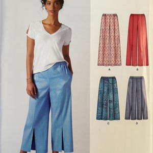 May include: New Look sewing pattern 6515 for wide-leg pants with side slits. The envelope features a white v-neck t-shirt and light blue culotte-style pants. Four variations are shown: patterned pink, solid red, blue paisley, and solid dark blue.