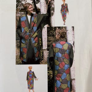 May include: A sewing pattern envelope for a long coat titled Purrfection Artistic Wearables 1034 Mosaic. The coat features a dark green base with a multi-colored mosaic pattern in blue, red, and olive green on the front panels and back.