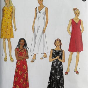 May include: New Look 6866 sewing pattern envelope featuring illustrations of five sleeveless dresses in various lengths and prints. The designs include a yellow floral dress, a white dress with a bow, a red floral dress, a black floral dress, and a red dress.